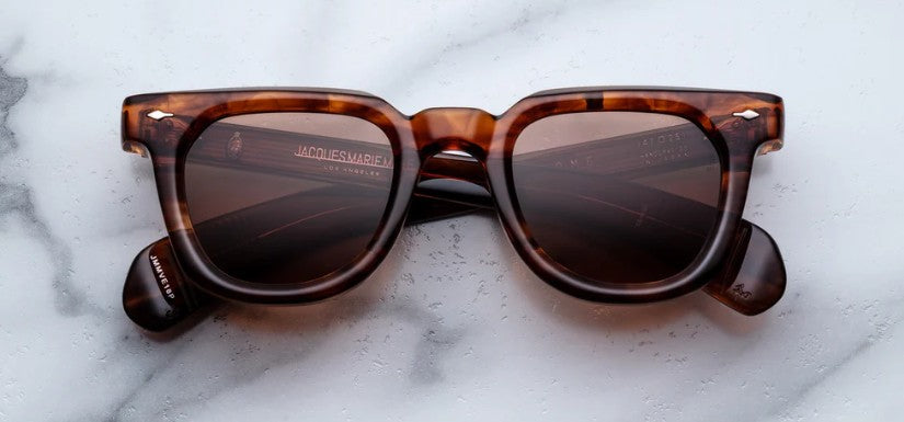 Tortoiseshell sunglasses on a marble surface